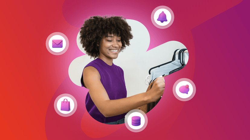 a woman in a purple shirt holds a hanger in her hand