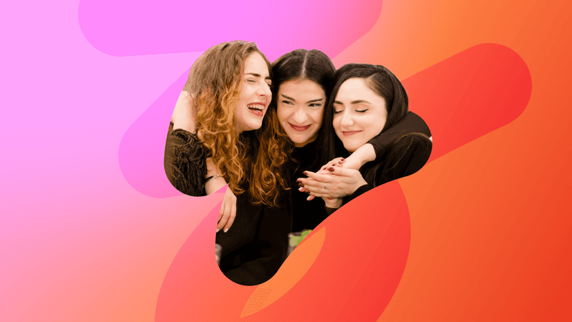 Three happy women embracing, set against a vibrant pink and orange abstract background.