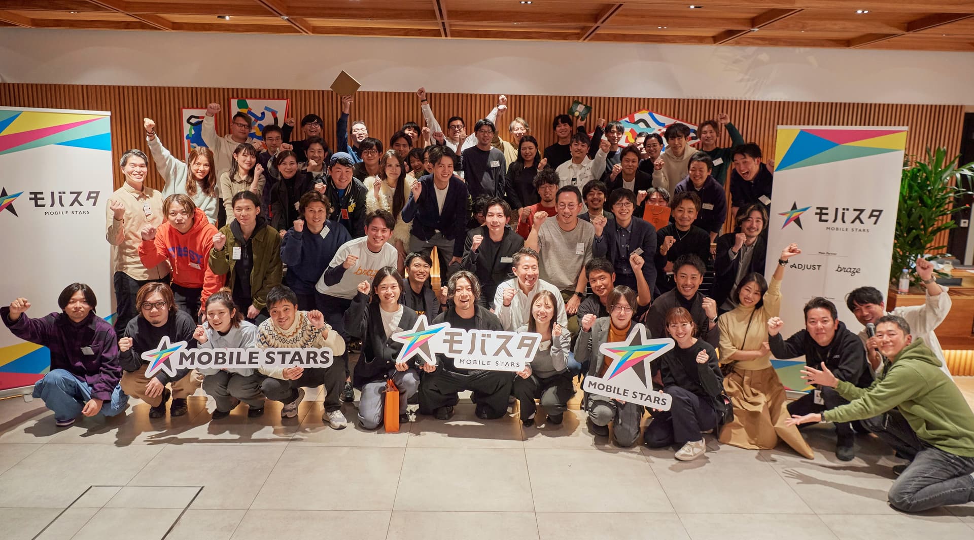 a large group of people are posing for a picture .