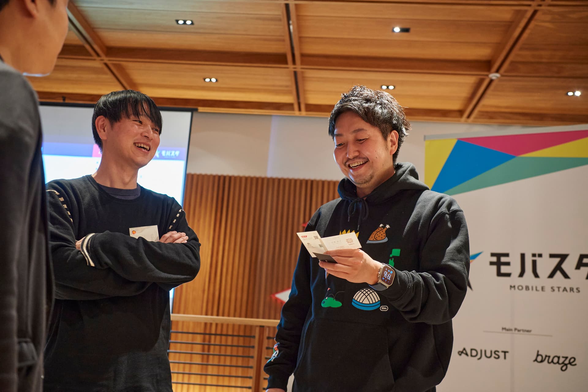 a group of men are standing next to each other in a room .