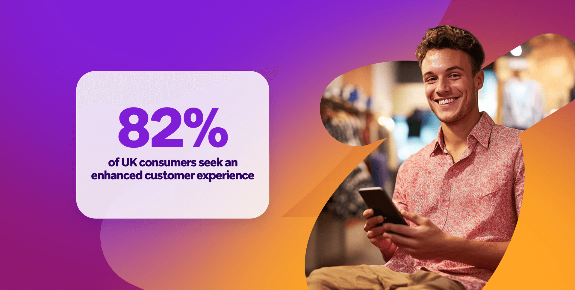 a man is smiling while holding a cell phone in front of a sign that says 82%