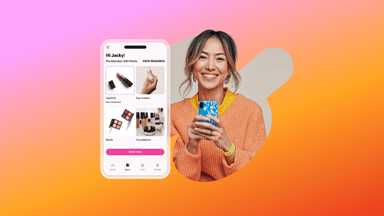 a woman is smiling while holding a cell phone that says hi jacky